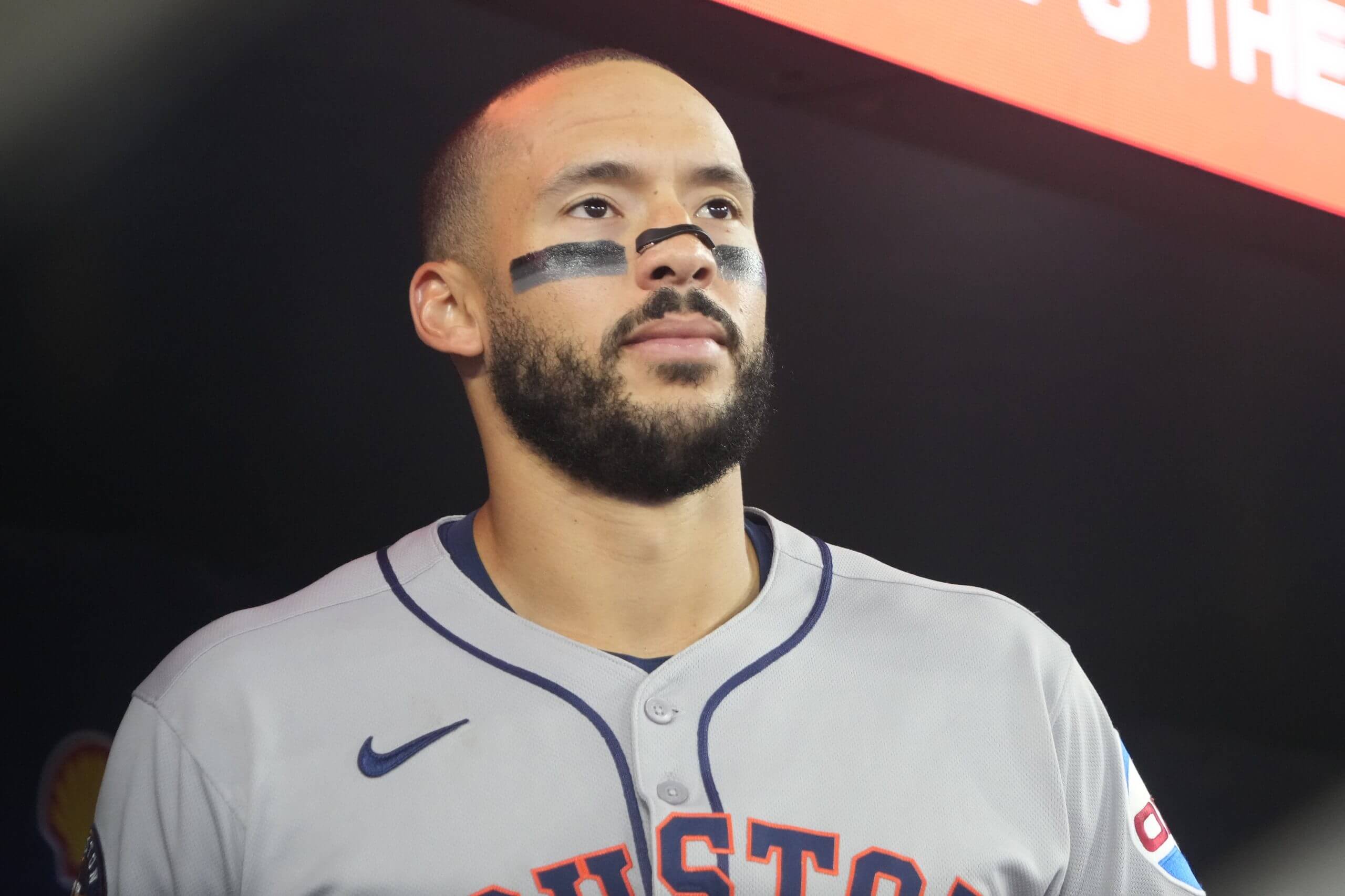 Carlos Correa looks toward the field from the visitors' dugout at Rogers Centre.