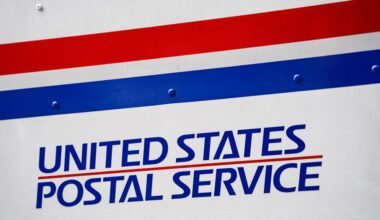A U.S. Postal Service delivery truck is parked beside the Canal Street station, Monday, Aug. 17, 2020, in New York. (AP Photo/John Minchillo)