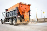 A sand truck makes its way through the icy Houston St., on Saturday, Jan. 24, 2026, in Dallas. 
