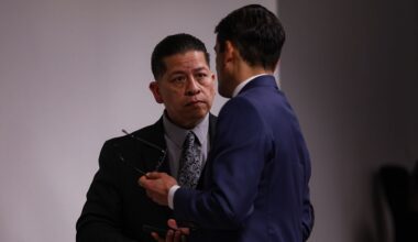 Former Uvalde school district police officer Adrian Gonzales, left, talks to his defense attorney Nico LaHood during a break on the 10th day of his trial at Nueces County Courthouse in Corpus Christi, Texas, Tuesday, Jan. 20, 2026. (Sam Owens/The San Antonio Express-News via AP, Pool)