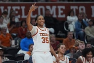 Texas forward Madison Booker (35) cheers for a score against Texas A&M during the second...