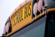 Icicles from sleet and rain coat a school bus Thursday, Feb. 2, 2023, in Richardson, Texas....