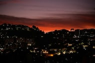 The sun rises, after US President Donald Trump said the U.S. has struck Venezuela and...