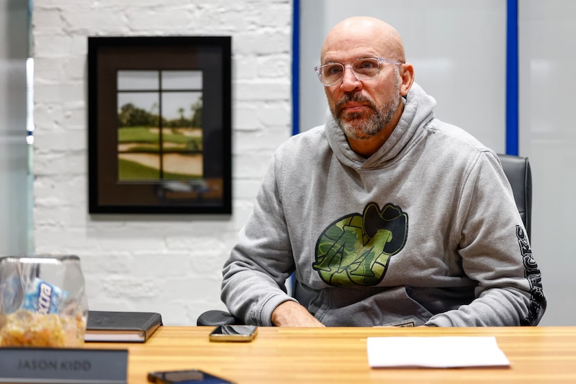 Dallas Mavericks head coach Jason Kidd listens to a question from Dallas Morning News...