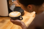 Wendy Cho of Dallas pours a swan during a Latte Art Throw Down + Coffee Community Party at...