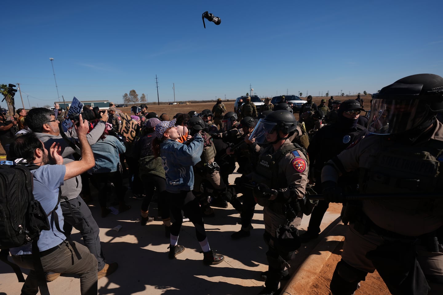 A canister of pepper spray launched by Texas troopers flew towards protesters outside the South Texas Family Residential Center detention facility on Wednesday.