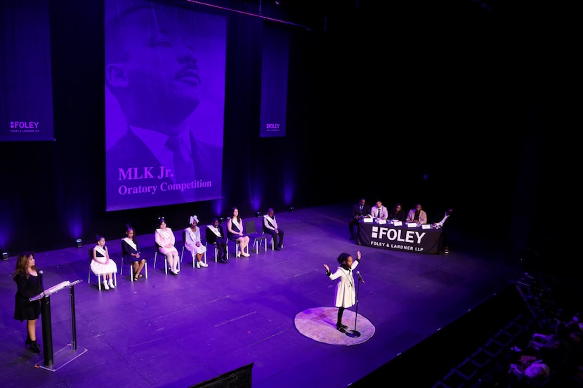 Before the judges (right) and fellow contestants,  Blen Teklu delivers her speech during the...