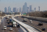 Drivers maneuver a mostly clear Interstate 30 following a winter storm on Wednesday, Jan....
