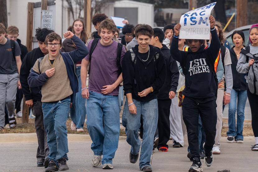 McCallum High School students walk out of class in protest of ICE in Austin, Texas, Friday,...