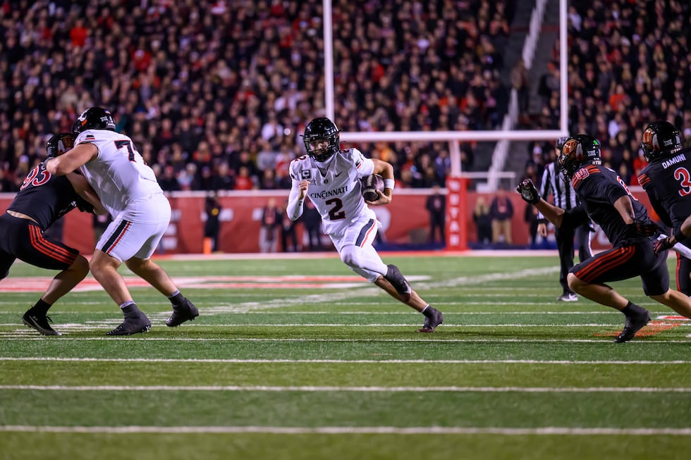 Cincinnati quarterback Brendan Sorsby (2) runs the football during the first half an NCAA...