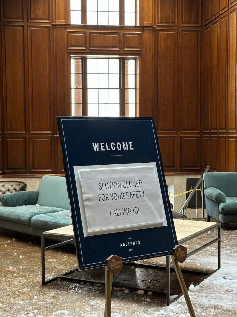 Ice falls through The Adolphus' glass atrium in the aftermath of the weekend winter storm in...