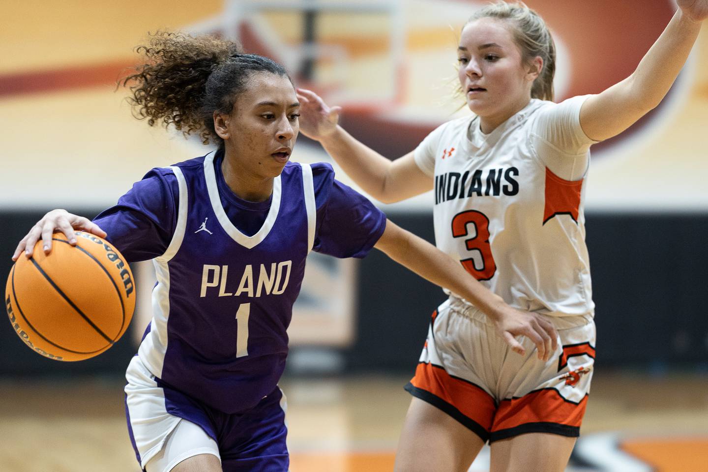 Plano's Le'Niya Viser dribbles the ball while being guarded by Sandwich's Khloe White during Tuesday's game in Sandwich.