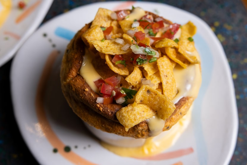 The Frito Chili Soufflé is topped with a cheddar sauce, Frito's and pico de gallo. 