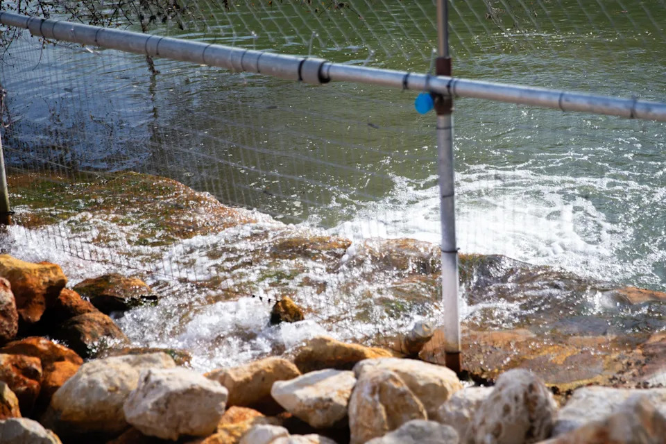 Water from six wells is discharged into the Nueces River in Corpus Christi on Dec. 12, 2025.