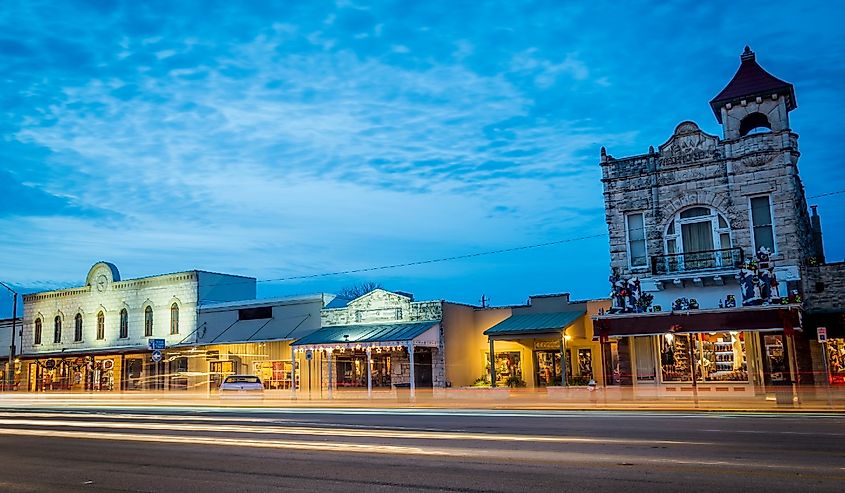 Fredericksburg, Texas, beautiful city night scape of road and land transportation against lighting