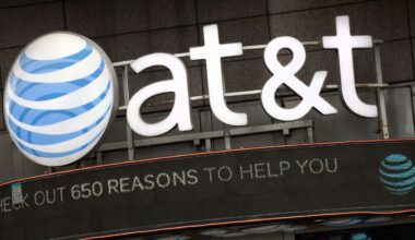 The AT&T logo is positioned above one of its retail stores in New York, Oct. 24, 2016. (AP Photo/Mark Lennihan)