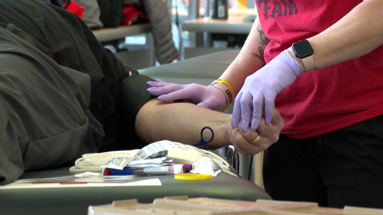 Preparing to donate blood at the 'Never Forget' blood drive on Thursday. (Spectrum News 1/Dan Reidy)