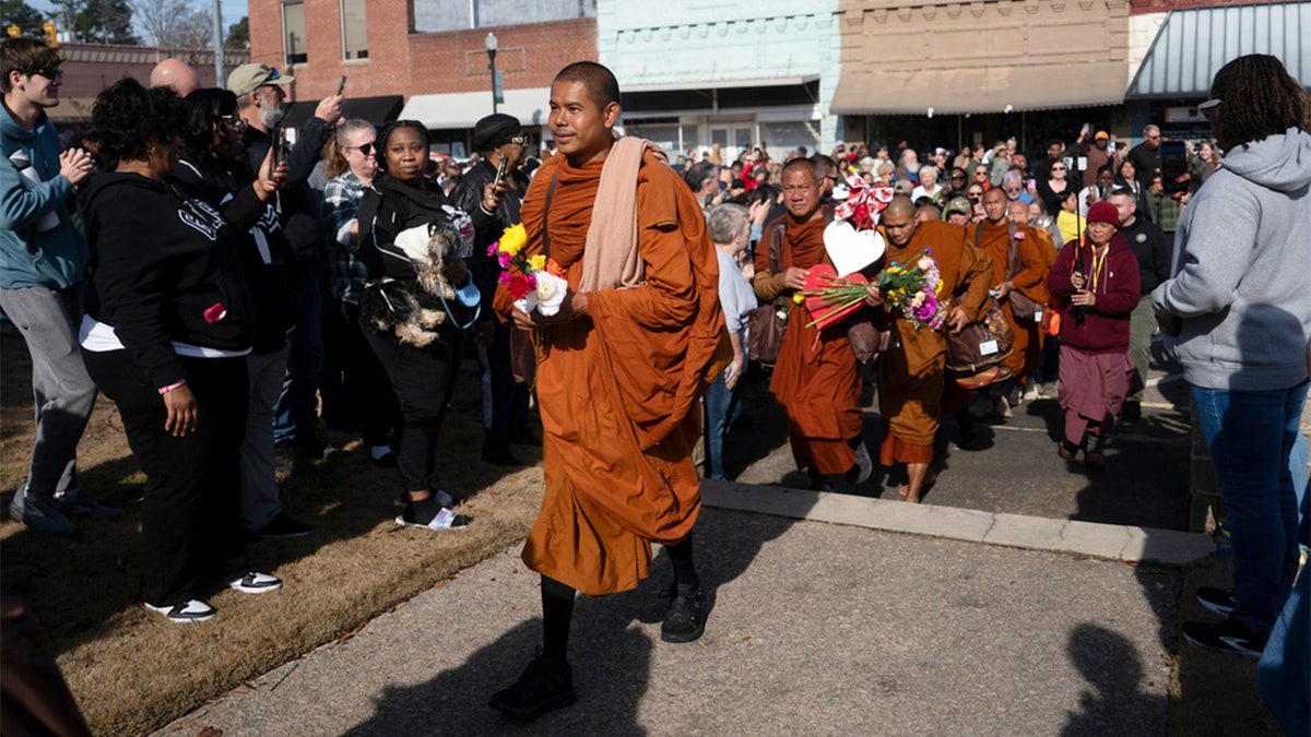 buddhist monks participate in walk for peace
