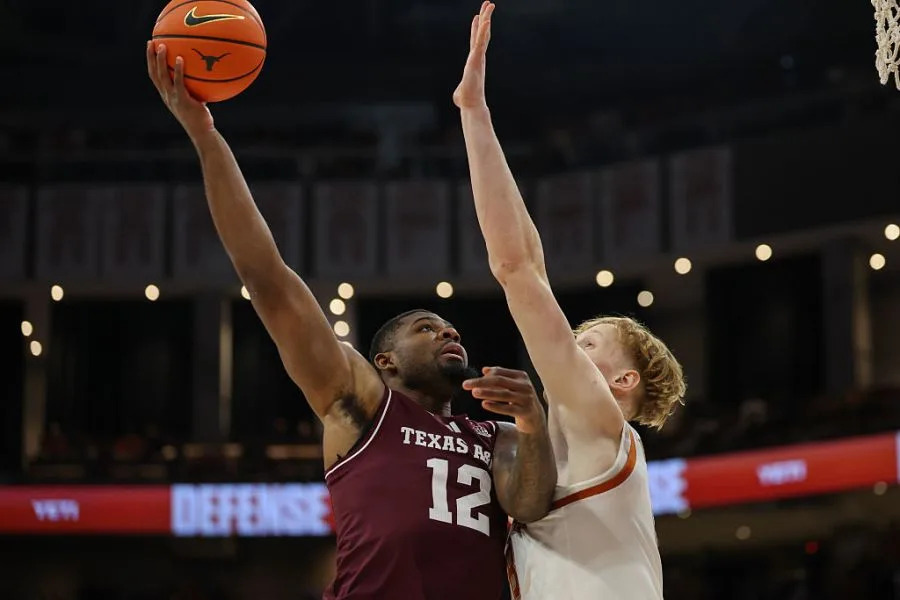 AUSTIN, TX – JANUARY 17: Forward Rashaun Agee #12 of the Texas A&M Aggies goes up for a shot over the arms of center Matas Vokietaitis #8 of the Texas Longhorns during the SEC college basketball game between Texas Longhorns and Texas A&M Aggies on January 17, 2026, at Moody Center in Austin, TX. (Photo by David Buono/Icon Sportswire via Getty Images)