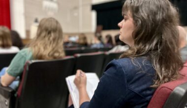 Houston ISD Magnet Info Session Parent Taking Notes