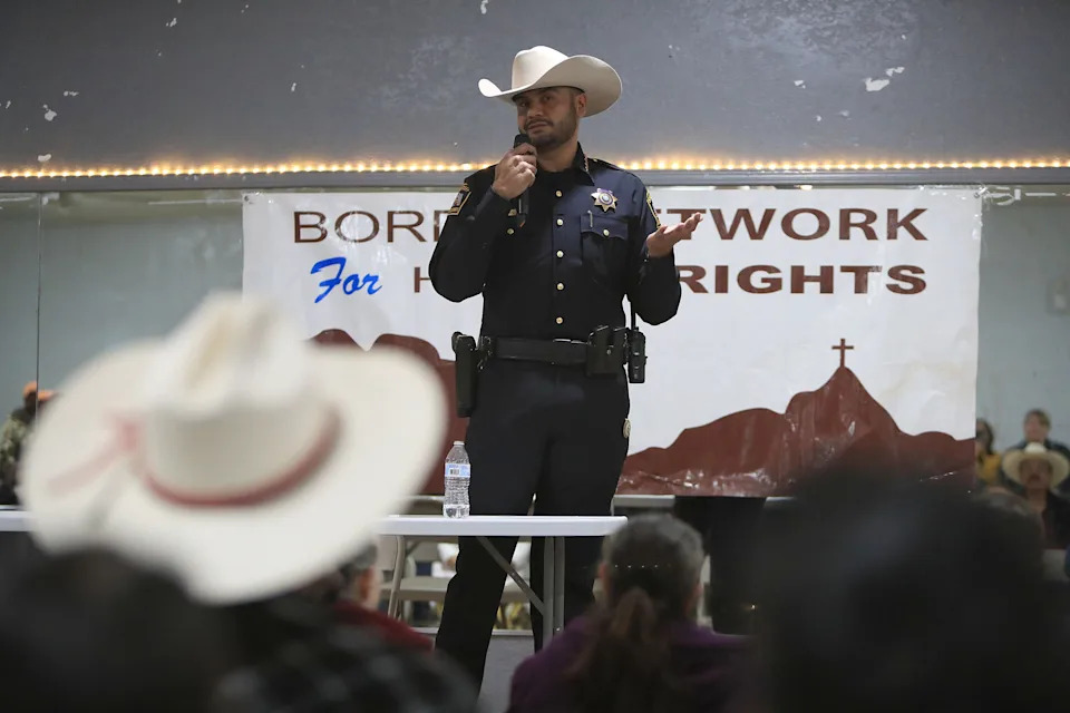 Sheriff Oscar Ugarte speaks with residents in eastern El Paso, Texas, at the Socorro Ramirez Community Center on Saturday, Jan. 17, 2026, as they voice concerns that Immigration and Customs Enforcement agents could enter their homes after a series of anti-immigrant raids in the area earlier in the week.
