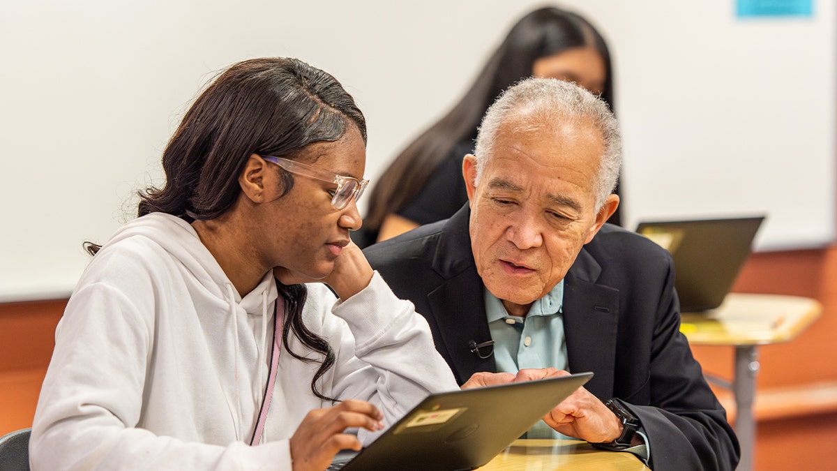 Houston Independent School District superintendent speaking with student