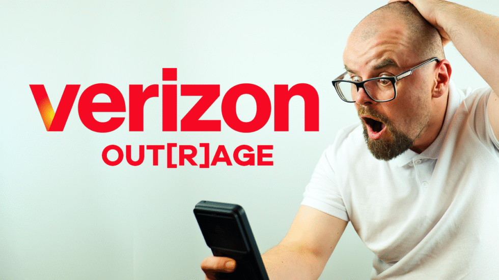 A picture of a bald man wearing glasses exasperated with his phone. The Verizon logo is superimposed with the word out[r]age under it.