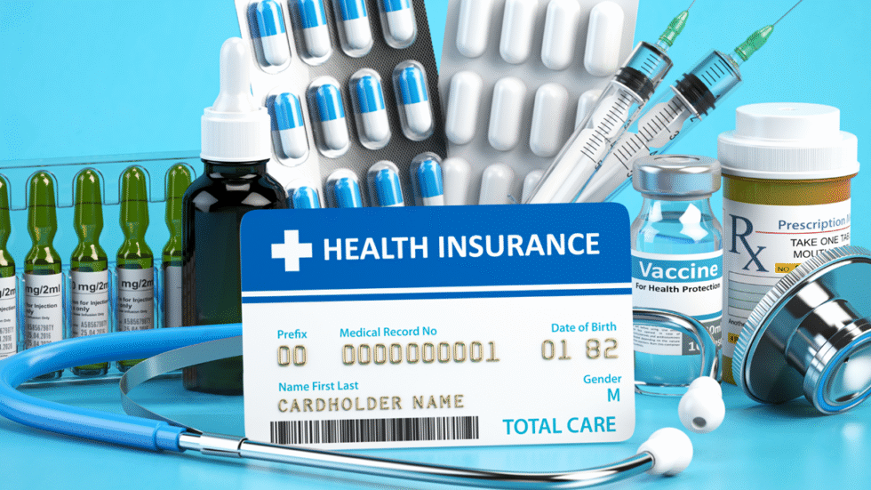 A picture of a health benefits card with medical supplies around it.