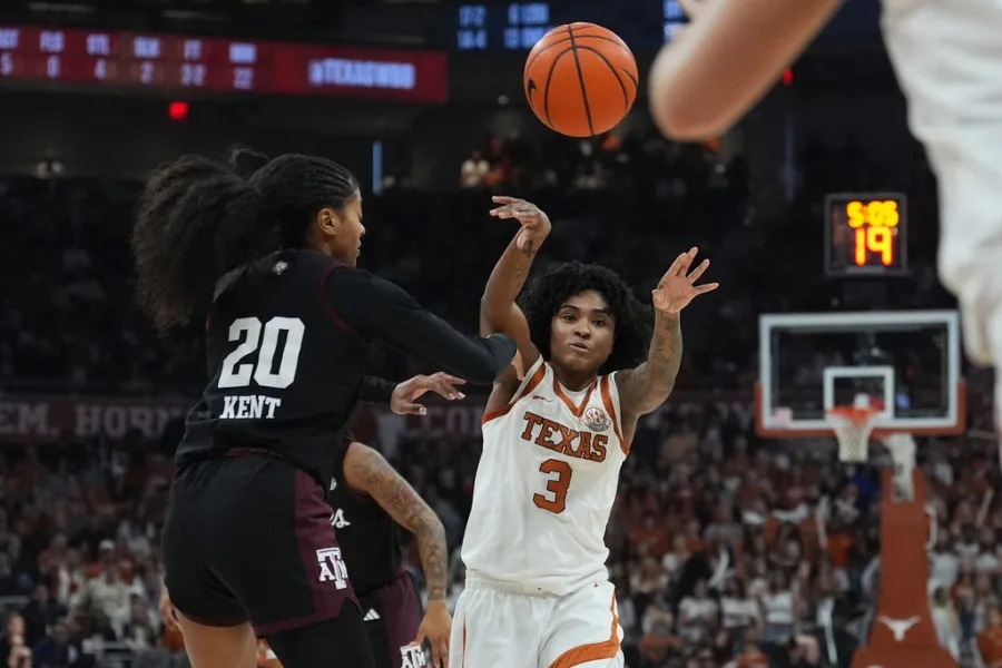 Texas guard Rori Harmon (3) moves the ballast Texas A&M guard Janae Kent (20) during the second half of an NCAA college basketball game in Austin, Texas, Sunday, Jan. 18, 2026. (AP Photo/Eric Gay)