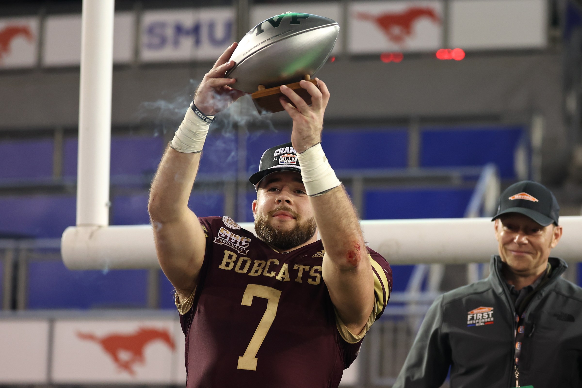 DALLAS, TEXAS - JANUARY 03: Lincoln Pare #7 of the Texas State Bobcats lifts the game MVP trophy after defeating the North Texas Mean Green in the SERVPRO First Responder Bowl at Gerald J. Ford Stadium on January 03, 2025 in Dallas, Texas. (Photo by Sam Hodde/Getty Images)