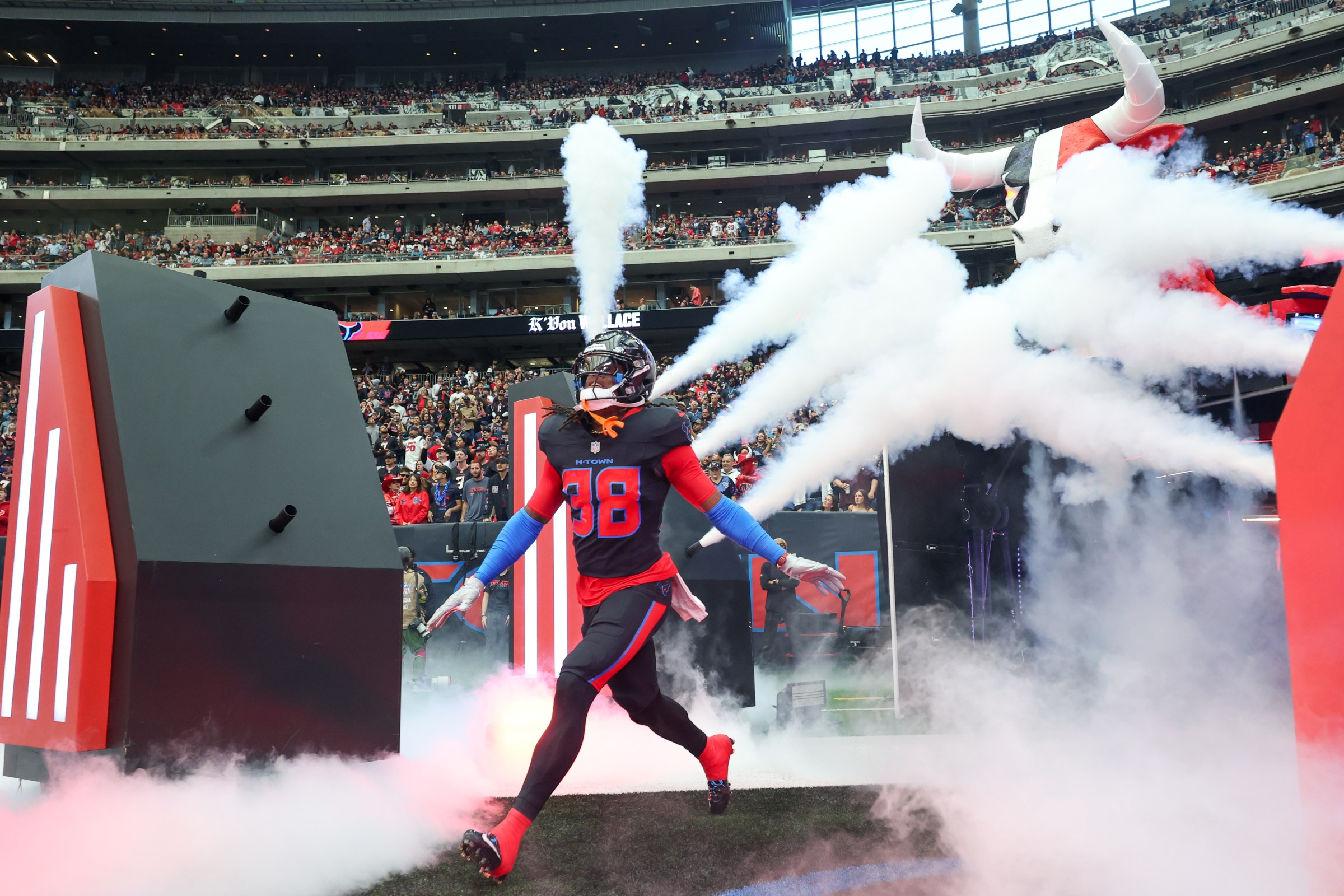 HOUSTON, TX - JANUARY 04: Cornerback K’Von Wallace #38 of the Houston Texans runs through smoke as he is announced as a defensive starter before the NFL game between Houston Texans and Indianapolis Colts on January 4, 2026, at NRG Stadium in Houston, TX. (Photo by David Buono/Icon Sportswire via Getty Images)