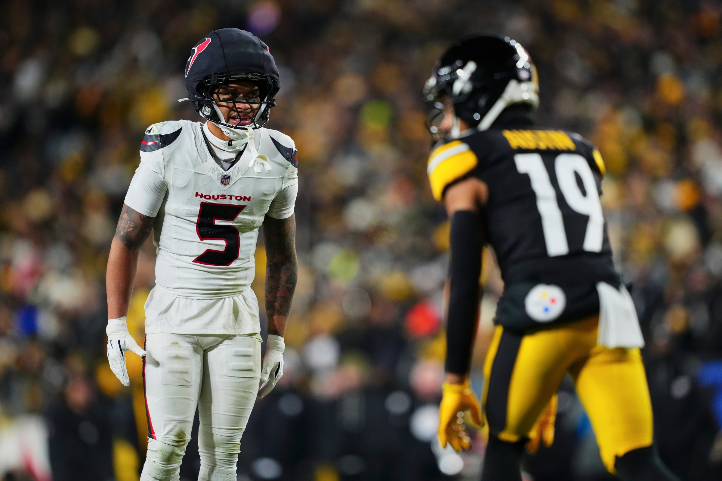 PITTSBURGH, PA - JANUARY 12: Jalen Pitre #5 of the Houston Texans defends against the Pittsburgh Steelers during the second half of an AFC Wild Card Playoff game at Acrisure Stadium on January 12, 2026 in Pittsburgh, Pennsylvania. (Photo by Cooper Neill/Getty Images)