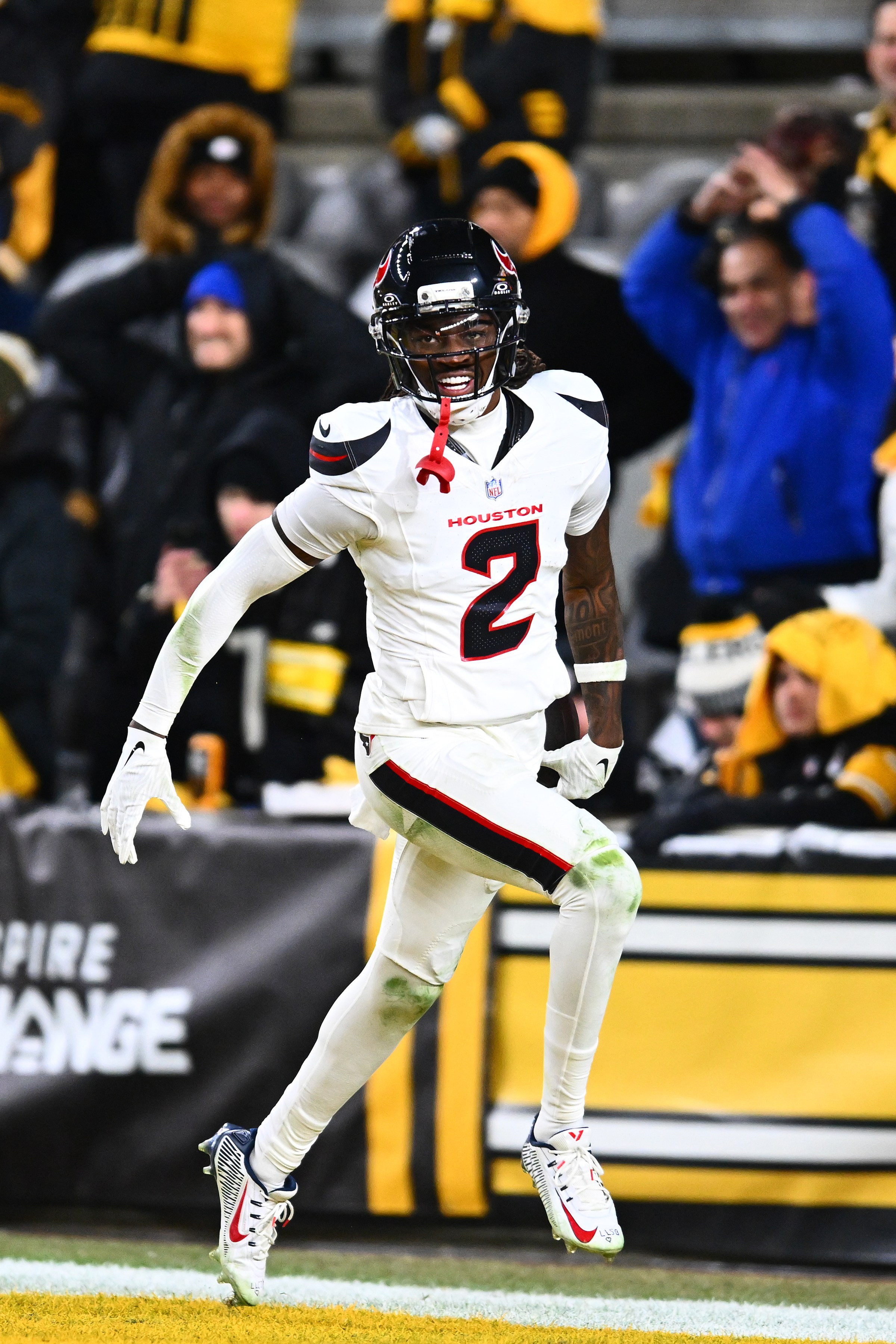 PITTSBURGH, PENNSYLVANIA - JANUARY 12: Calen Bullock #2 of the Houston Texans celebrates after returning an interception for a touchdown in the fourth quarter of an NFL wild card playoff game against the Pittsburgh Steelers at Acrisure Stadium on January 12, 2026 in Pittsburgh, Pennsylvania. (Photo by Joe Sargent/Getty Images)