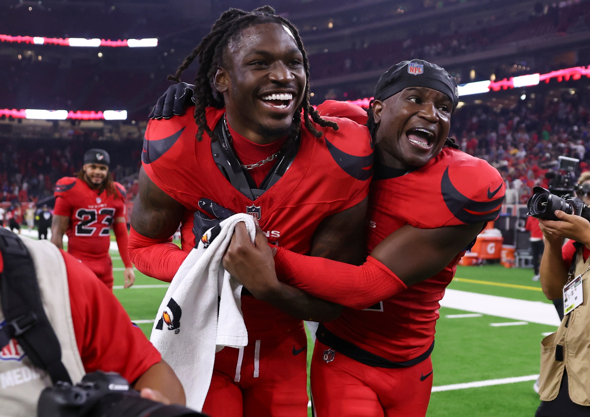 Nov 20, 2025; Houston, Texas, USA; Houston Texans cornerback Kamari Lassiter (4) and safety Calen Bullock (2) celebrate after the game against the Buffalo Bills at NRG Stadium. Mandatory Credit: Troy Taormina-Imagn Images