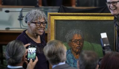 Opal Lee, left, who helped make Juneteenth a federally recognized holiday, poses with her portrait after it was unveiled in the Texas Senate Chamber, Wednesday, Feb. 8, 2023, in Austin, Texas. (AP Photo/Eric Gay)