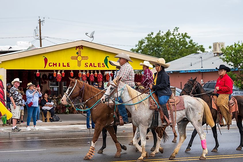 Local farm and ranch workers riding horses in the parade during the annual Hatch Chile Festival in Hatch, New Mexico.