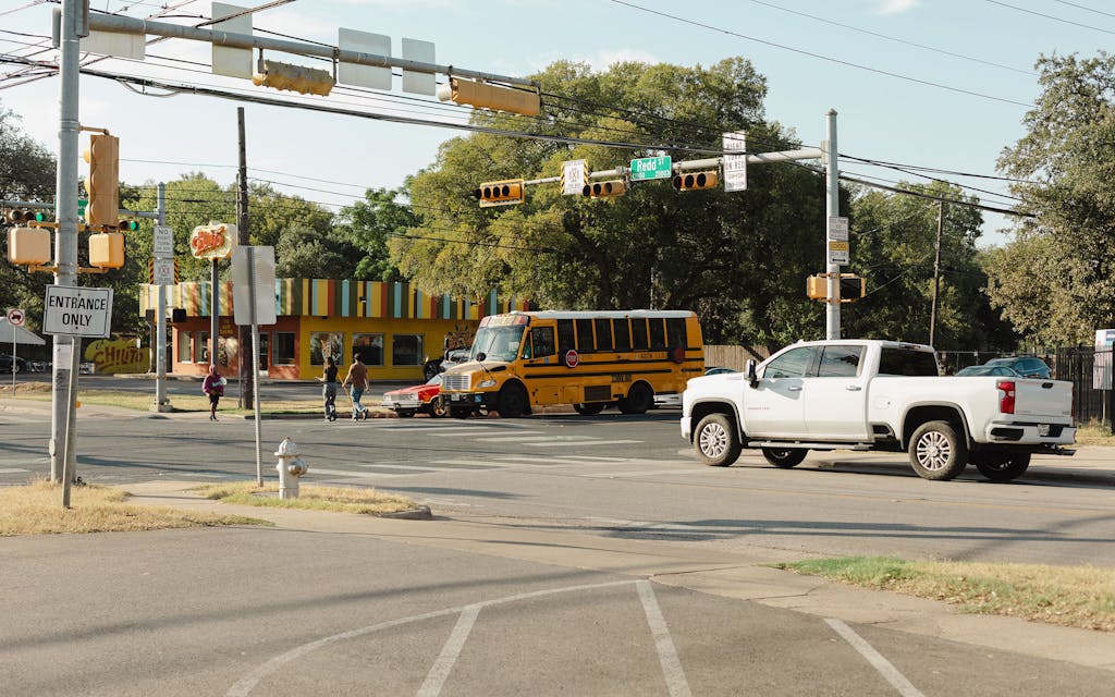 A school bus passes by Sunrise Community Church.