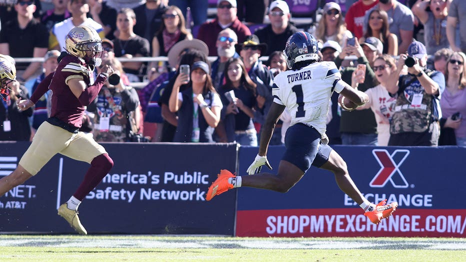 Aaron Turner #1 of the Rice Owls scores a touchdown against the Texas State Bobcats during the first half of the 2026 Lockheed Martin Armed Forces Bowl at Amon G. Carter Stadium on January 02, 2026 in Fort Worth, Texas.