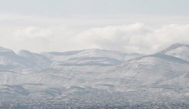 Snow obscures writing on the side of the mountains above Ciudad Juarez, Mexico, as seen from El Paso, Texas, on Wednesday, Feb. 5, 2020. A few inches of snow led to slow starts at schools in El Paso and caused hour-long delays on local roads. (AP Photo/Cedar Attanasio)