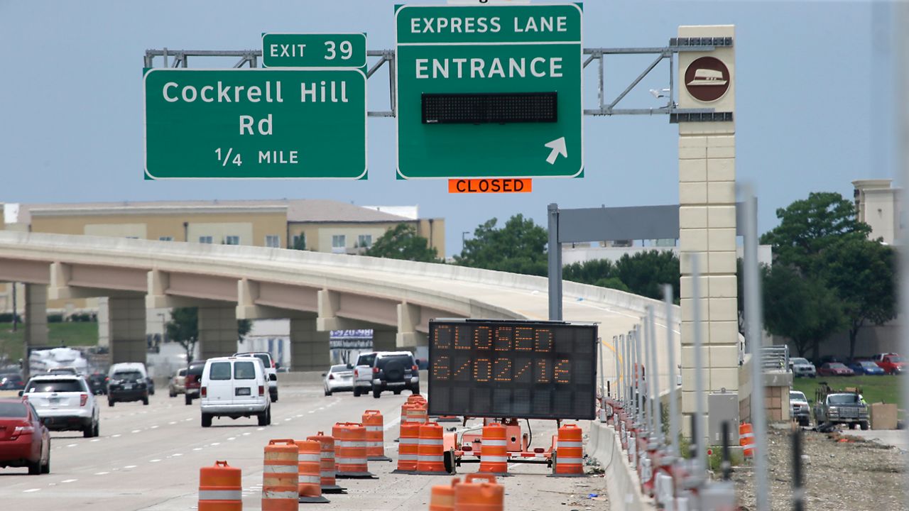 A construction sign warns drivers on I-30 of a road closure in Dallas, Tuesday, May 31, 2016. (AP Photo/LM Otero)