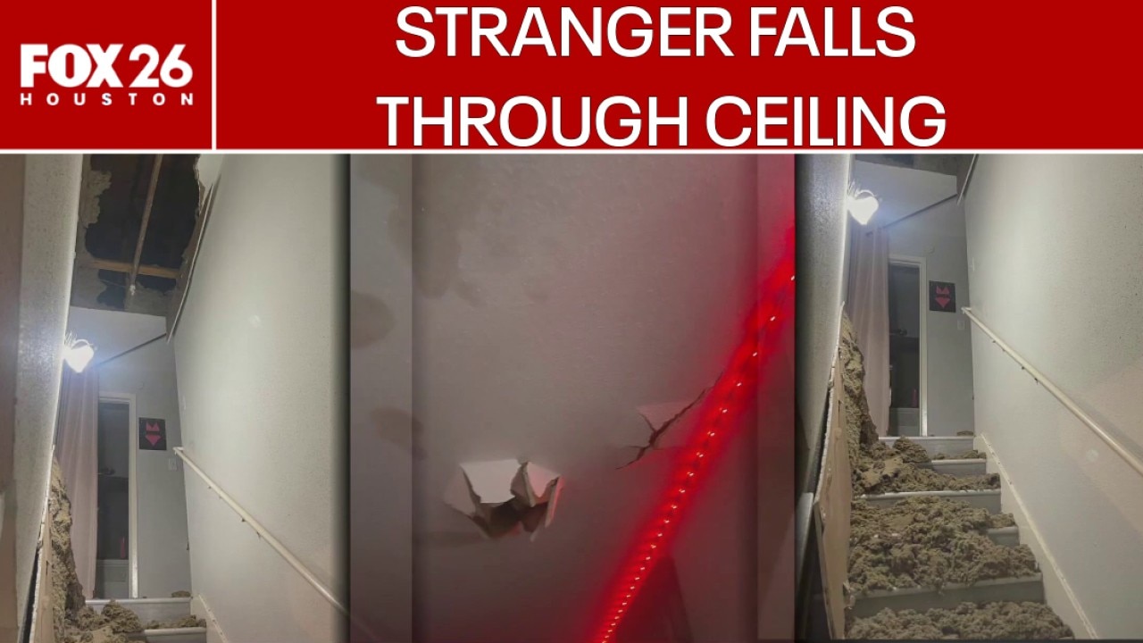 Stranger falls through apartment ceiling