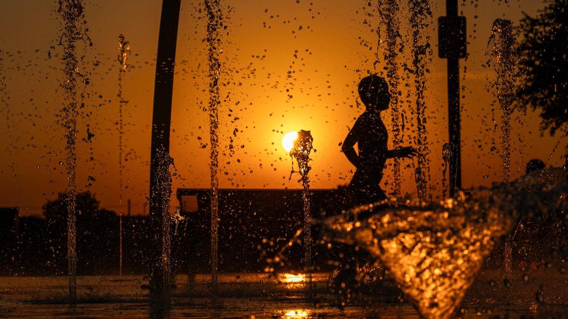 Emmanuel Salazar, 7, runs through the water on the Watauga Splash Pad at Capp Smith Park in Watauga on Thursday, June 27, 2024. Temperatures rose to over 100 degrees as summer begins to heat up in North Texas.