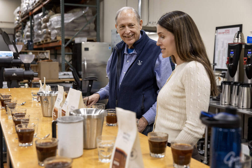 George Howell and his daughter Jennifer Howell, the company's vice president, discuss coffee samples at a cupping session at the roastery in Acton, Mass. (Robin Lubbock/WBUR)