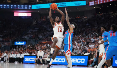 Feb 7, 2026; Austin, Texas, USA; Texas Longhorns guard Tramon Mark (12) makes a lay up against Mississippi Rebels guard Kezza Giffa (13) during the first half at Moody Center. Mandatory Credit: Dustin Safranek-Imagn Images