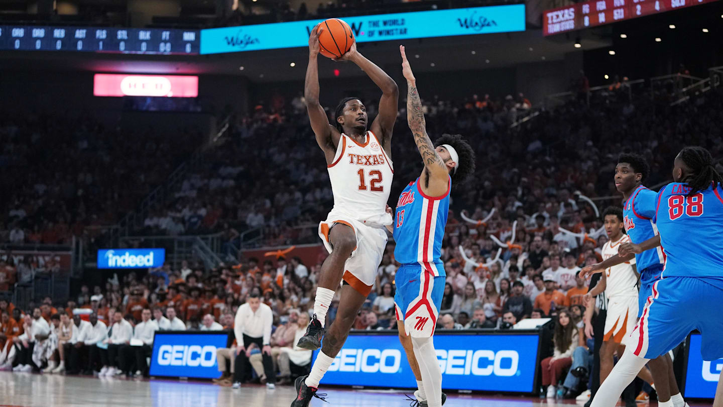 Feb 7, 2026; Austin, Texas, USA; Texas Longhorns guard Tramon Mark (12) makes a lay up against Mississippi Rebels guard Kezza Giffa (13) during the first half at Moody Center. Mandatory Credit: Dustin Safranek-Imagn Images