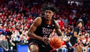 Feb 14, 2026; Tucson, Arizona, USA; Texas Tech Red Raiders forward JT Toppin (15) dribbles and dunks the ball during the first half of the game against the Arizona Wildcats at McKale Memorial Center. Mandatory Credit: Aryanna Frank-Imagn Images