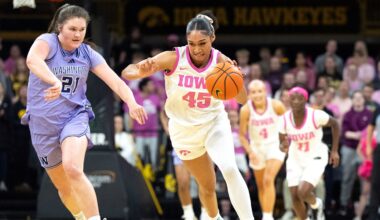 Washington forward Brynn McGaughy (21) trails Iowa forward Hannah Stuelke (45) as she drives down court Feb. 11, 2026 at Carver-Hawkeye Arena in Iowa City, Iowa.