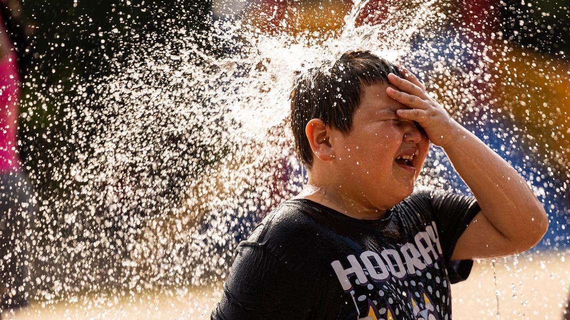 Adrian Olmos, 10, cools down on the splash pad at Sycamore Water Park in Fort Worth on Thursday, June 27, 2024. Temperatures rose to over 100 degrees as the summer heatwave begins to heat up.