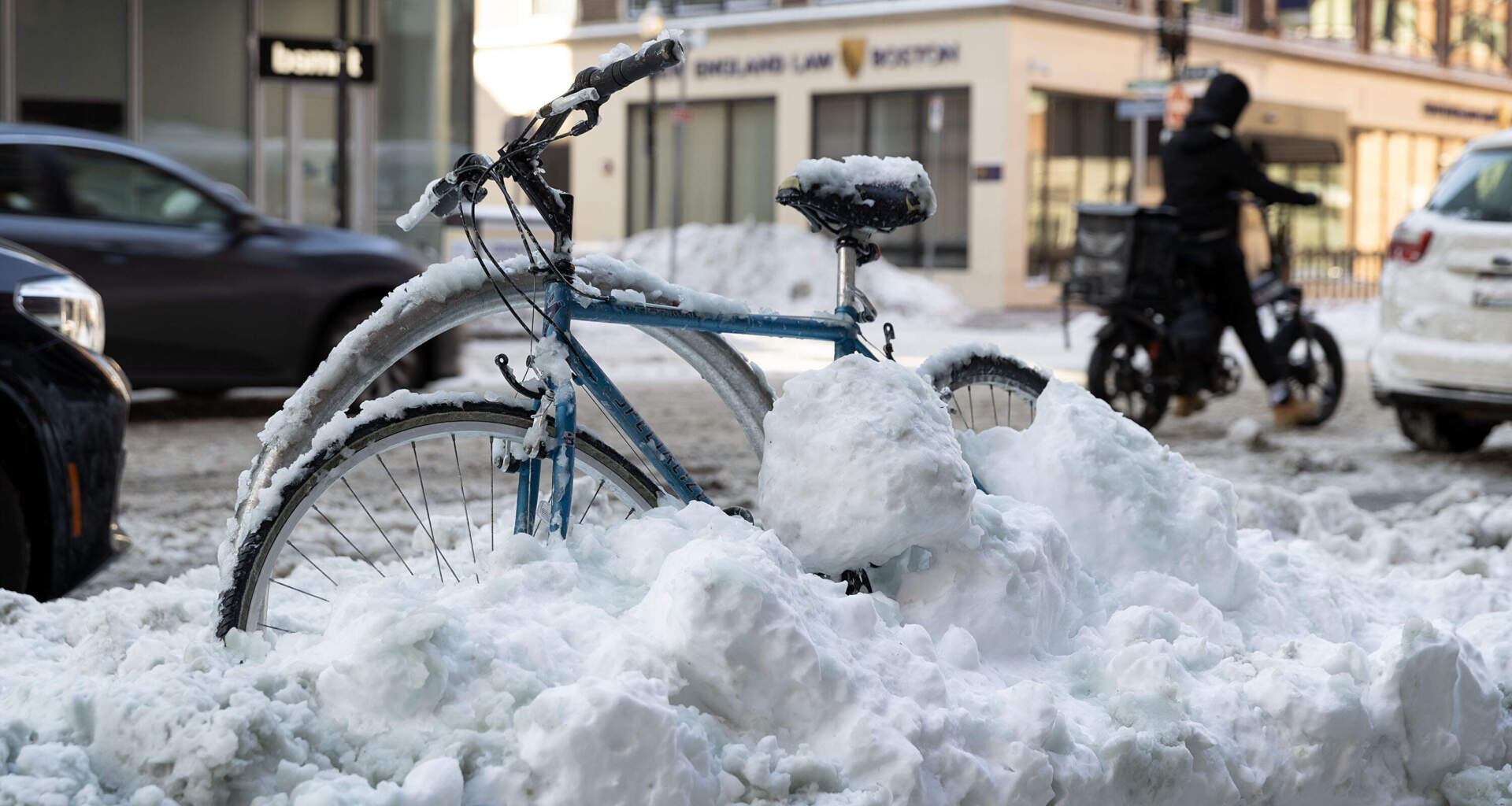 A frozen bicycle on Charles St. in downtown Boston, waits to be dug out by its owner, Feb. 24, 2026. (Robin Lubbock/WBUR)