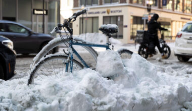 A frozen bicycle on Charles St. in downtown Boston, waits to be dug out by its owner, Feb. 24, 2026. (Robin Lubbock/WBUR)